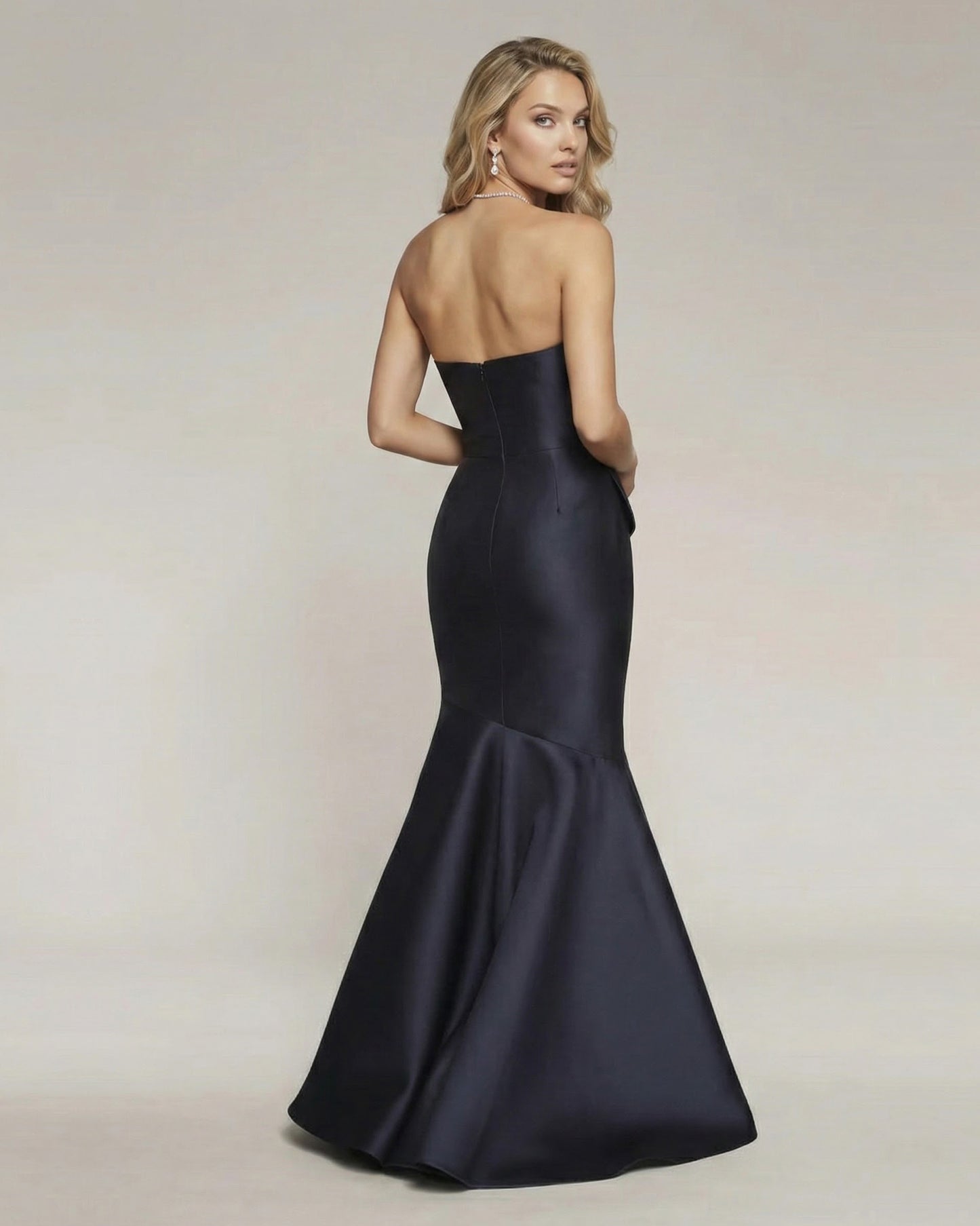 MIDNIGHT PEPLUM MERMAID GOWN